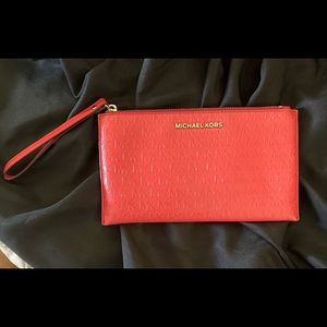 Beautiful Coral Michael Kors clutch/wrist